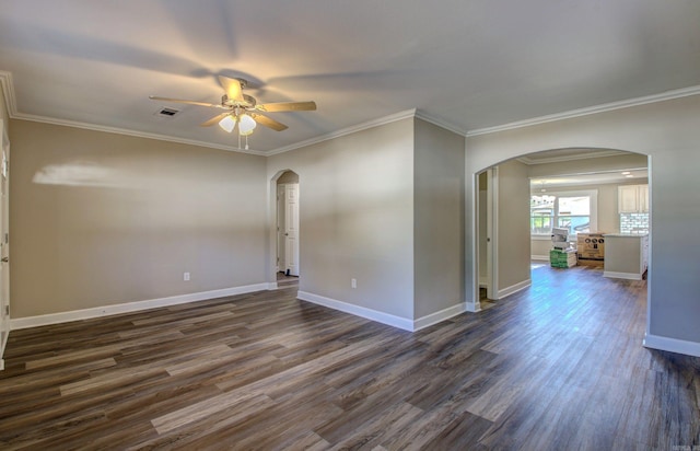 spare room featuring dark hardwood / wood-style floors, ceiling fan, and crown molding