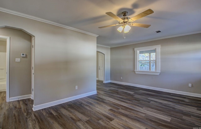 unfurnished room with ornamental molding, ceiling fan, and dark wood-type flooring