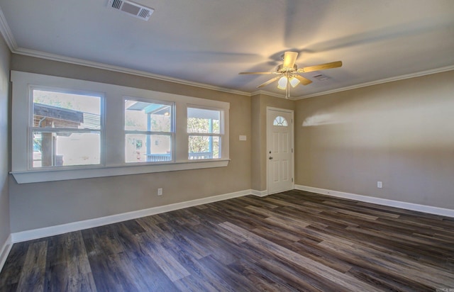 foyer entrance with ceiling fan, dark hardwood / wood-style flooring, and ornamental molding