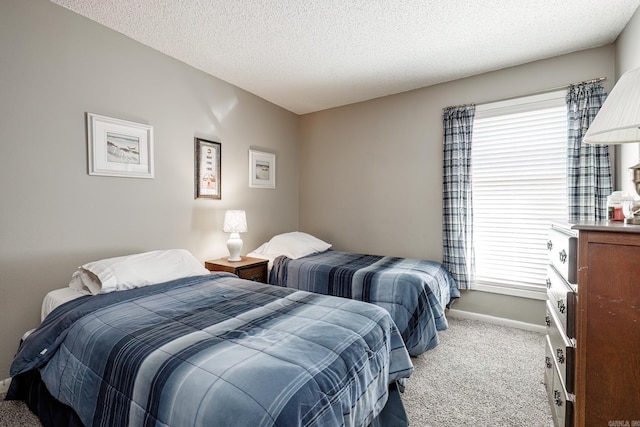 carpeted bedroom with a textured ceiling