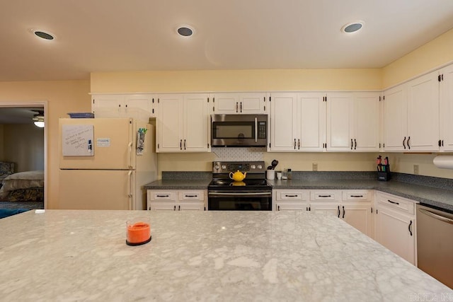 kitchen featuring white cabinets and stainless steel appliances