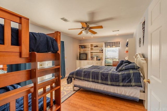 bedroom with wood-type flooring and ceiling fan