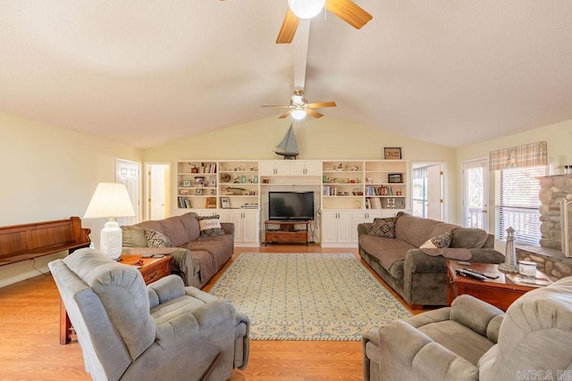 living room with lofted ceiling, ceiling fan, and light wood-type flooring