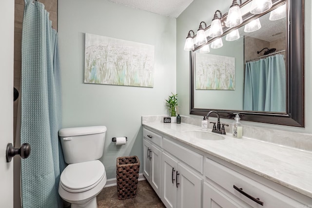 bathroom with tile patterned floors, walk in shower, vanity, a textured ceiling, and toilet