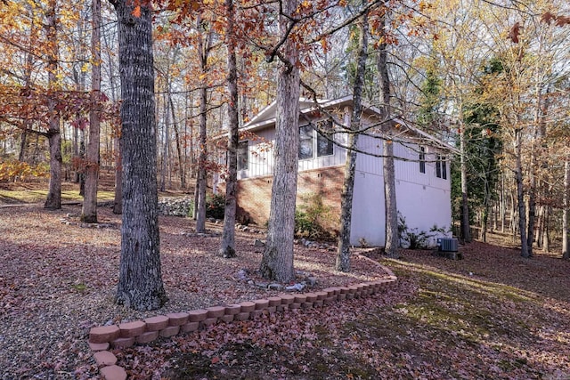 view of yard with central air condition unit