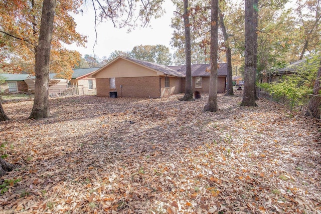 view of side of property with central AC unit