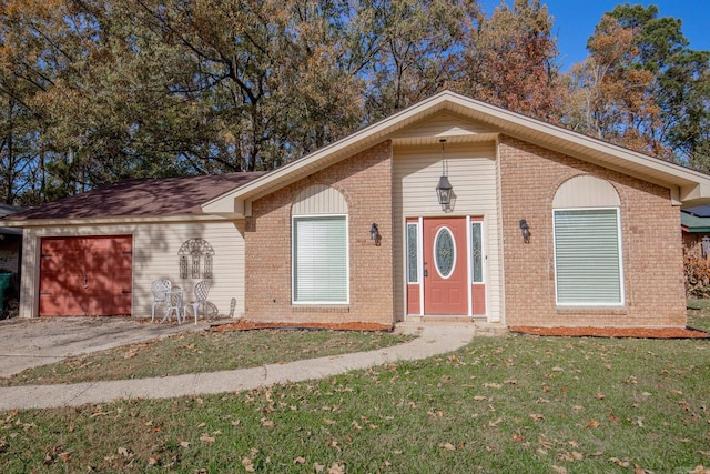 view of front of house with a front lawn and a garage