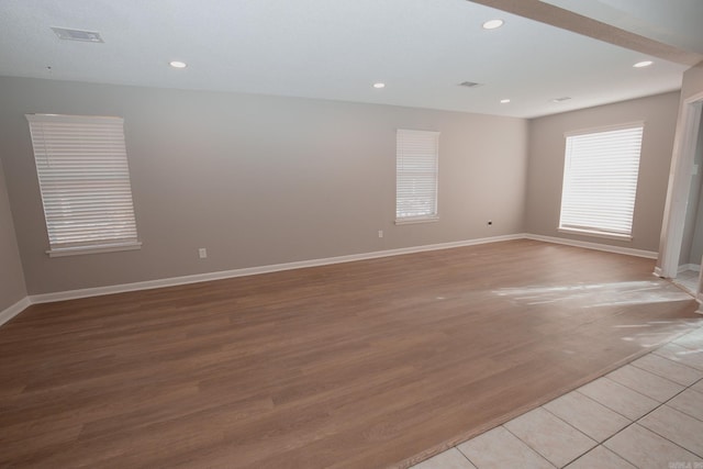 spare room featuring light hardwood / wood-style flooring