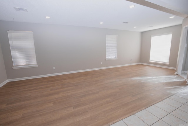 spare room featuring light hardwood / wood-style floors