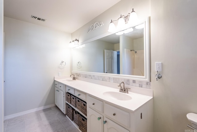 bathroom featuring tile patterned floors and vanity