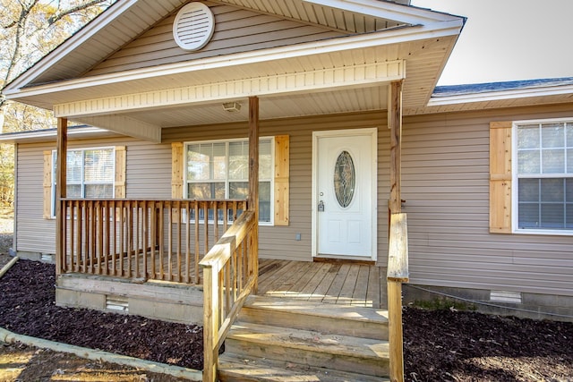 property entrance featuring a porch