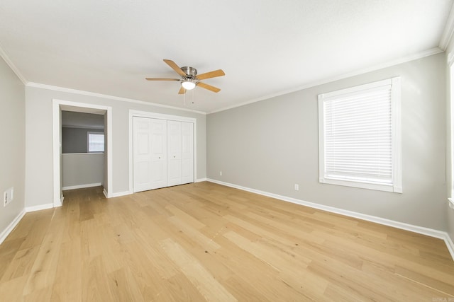 unfurnished bedroom with ceiling fan, light wood-type flooring, and crown molding