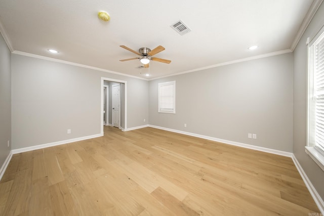 unfurnished room featuring ceiling fan, ornamental molding, a healthy amount of sunlight, and light hardwood / wood-style floors