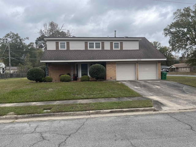 front of property featuring a front yard and a garage