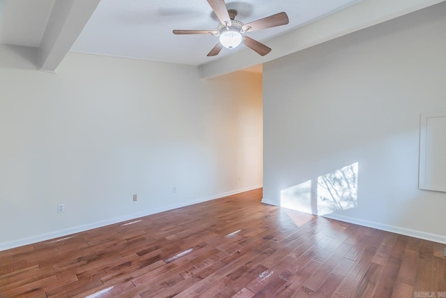 unfurnished room with beam ceiling, ceiling fan, and hardwood / wood-style flooring