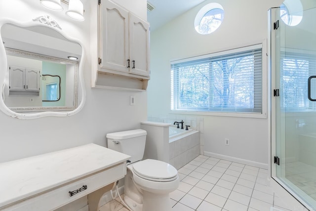 bathroom with tile patterned floors, toilet, and shower with separate bathtub