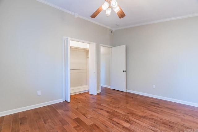 unfurnished bedroom with a closet, ceiling fan, crown molding, and light wood-type flooring