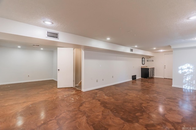 basement with a textured ceiling