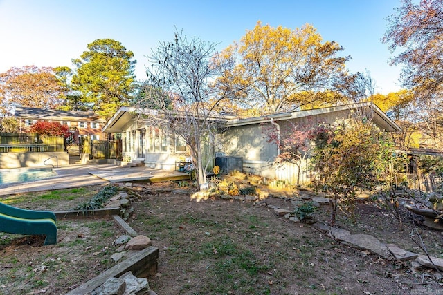 back of house with a patio