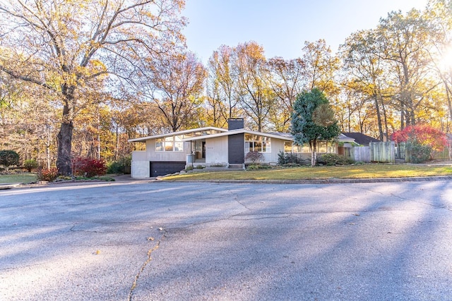 single story home featuring a garage