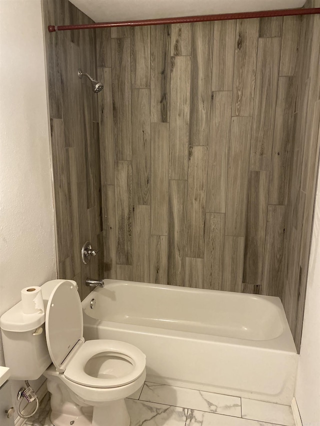 bathroom with tub / shower combination and toilet