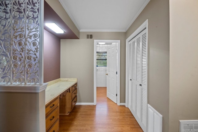 bathroom with wood-type flooring and ornamental molding