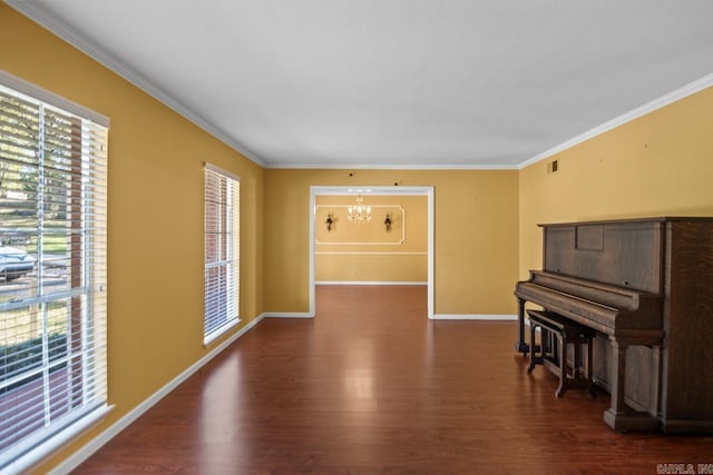 interior space featuring dark hardwood / wood-style flooring, ornamental molding, and a notable chandelier