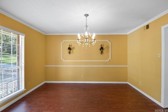 spare room featuring a healthy amount of sunlight, dark hardwood / wood-style floors, and a notable chandelier