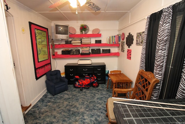 interior space with crown molding, carpet floors, and ceiling fan