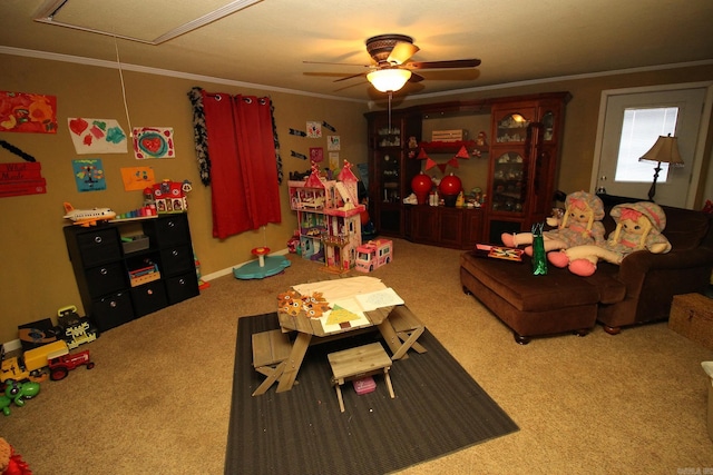 rec room featuring ceiling fan, ornamental molding, and light carpet
