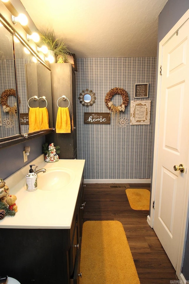 bathroom featuring vanity and wood-type flooring