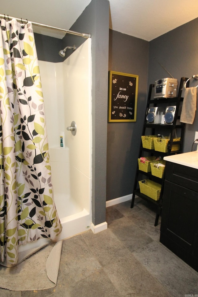 bathroom featuring vanity and a shower with shower curtain