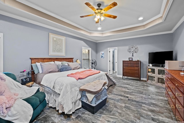 bedroom featuring ceiling fan, a raised ceiling, and crown molding