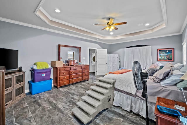 bedroom featuring ceiling fan, crown molding, and a tray ceiling