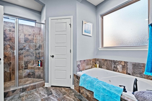 bathroom with separate shower and tub