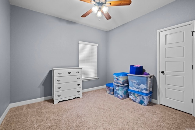 rec room with ceiling fan and light colored carpet