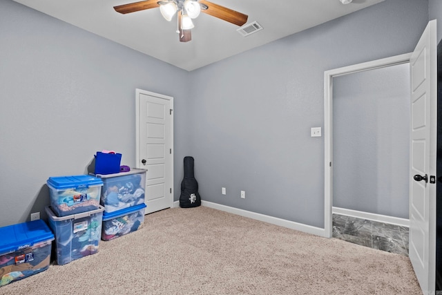 rec room with carpet floors and ceiling fan