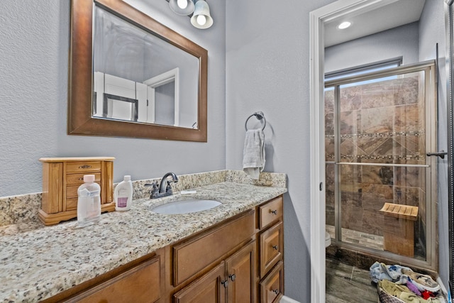 bathroom with vanity and walk in shower