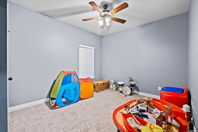 rec room featuring carpet flooring and ceiling fan