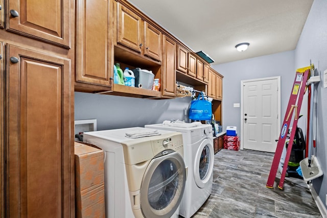 washroom with cabinets and independent washer and dryer