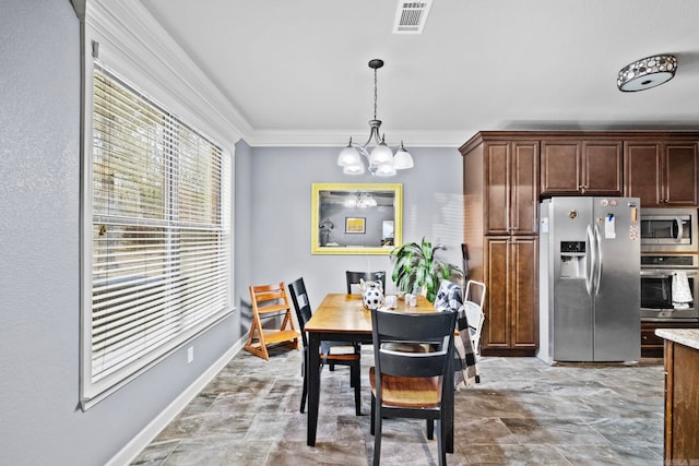 dining space featuring a notable chandelier and ornamental molding