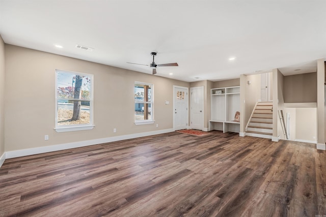 unfurnished living room with hardwood / wood-style flooring and ceiling fan