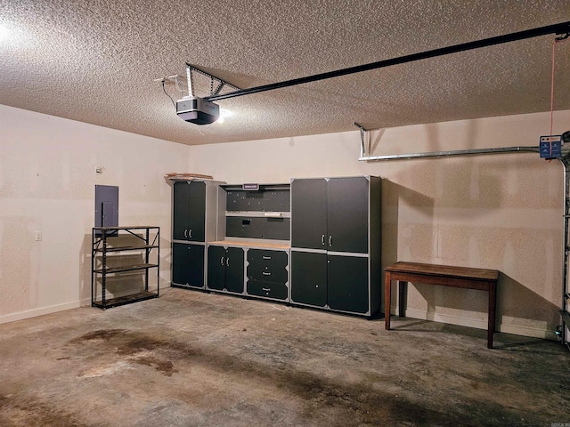 garage with electric panel and a garage door opener