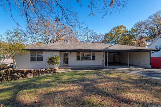 single story home featuring a front yard, a porch, and a carport