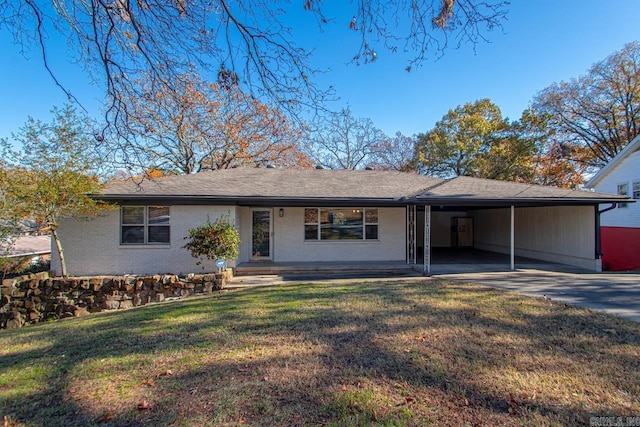 3630 Idlewild Ave, North Little Rock, AR 72116 - view of front facade with an attached carport, a front yard, brick siding, and concrete driveway