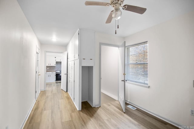 3630 Idlewild Ave, North Little Rock, AR 72116 - hallway featuring light wood-type flooring and baseboards
