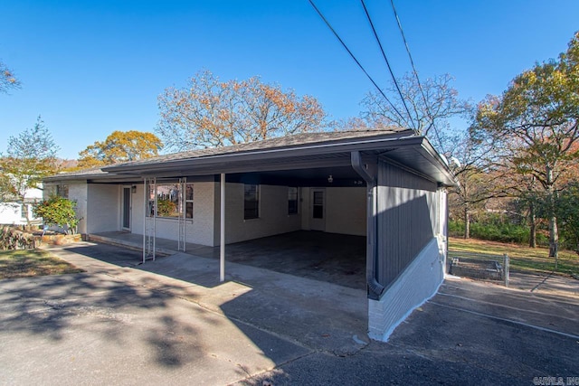 view of side of home featuring a carport