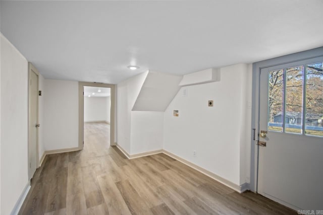 bonus room with light hardwood / wood-style floors