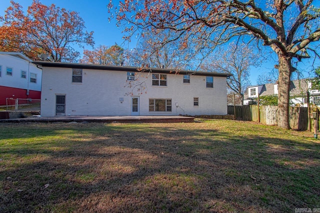 back of house with a yard