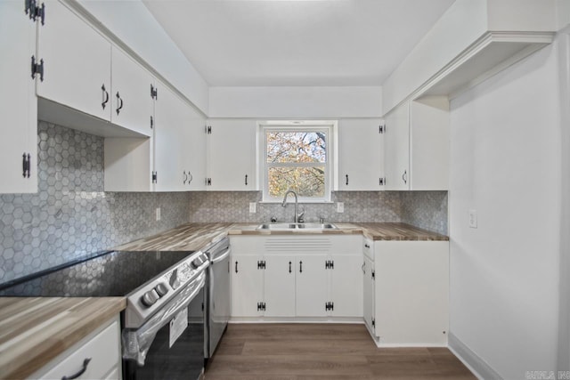 3630 Idlewild Ave, North Little Rock, AR 72116 - kitchen with stainless steel appliances, white cabinets, dark wood-style flooring, and decorative backsplash